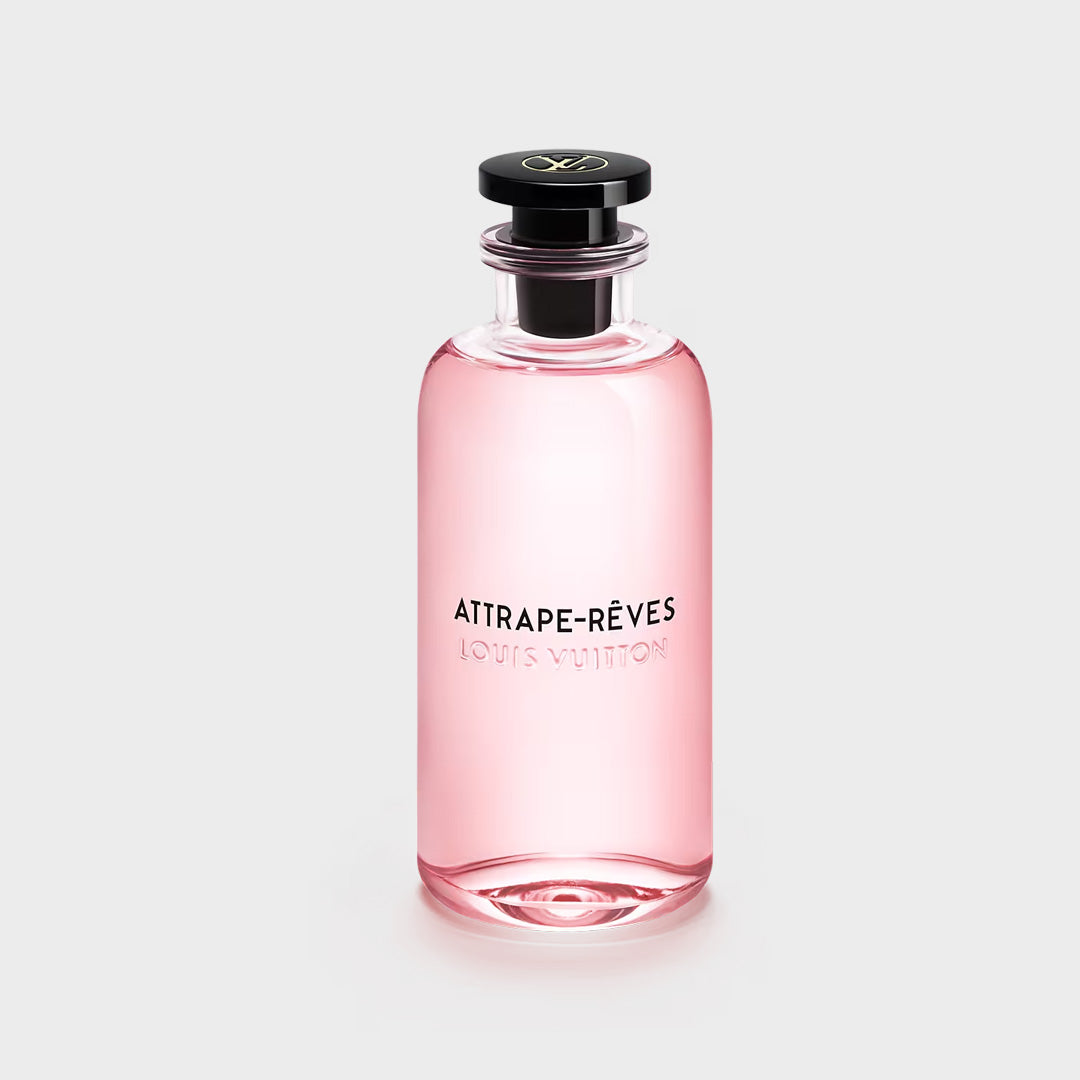 Pink perfume bottle with black cap on a light gray background